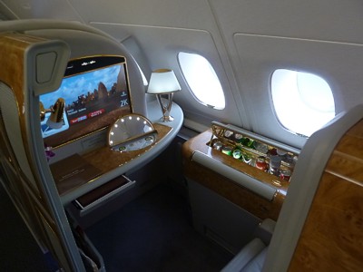 Emirates First Class A380 seat a full suite with closing doors & mini bar