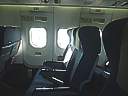Qantaslink Boeing 717 at Hamilton Island May 2003. Emergency exit rows 15 and 16
