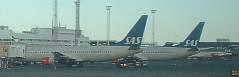 two 767s and an MD82 at dusk at ARN April 2002