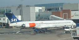 London LHR MD82 on the stand at terminal 3 April 2003