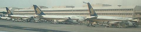 A 747, and two 777s at Singapore Changi