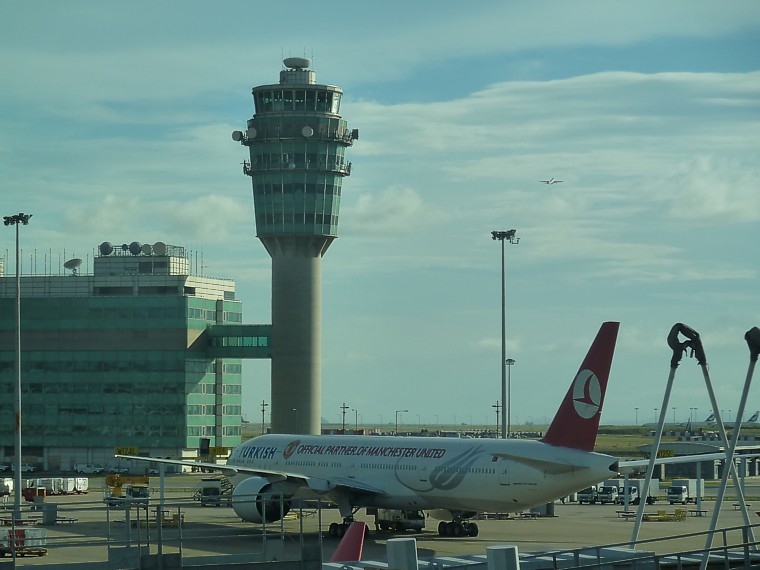 Turkish Airlines Boeing 777 in the early morning sunshine at Hong Kong June 2011